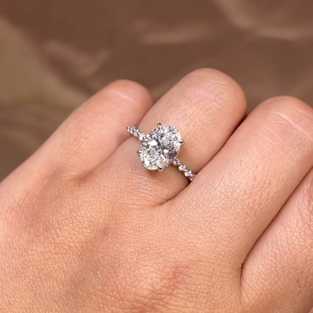 2ct Oval Diamond Ring on a Pavé Band With a Hidden Gallery Halo
