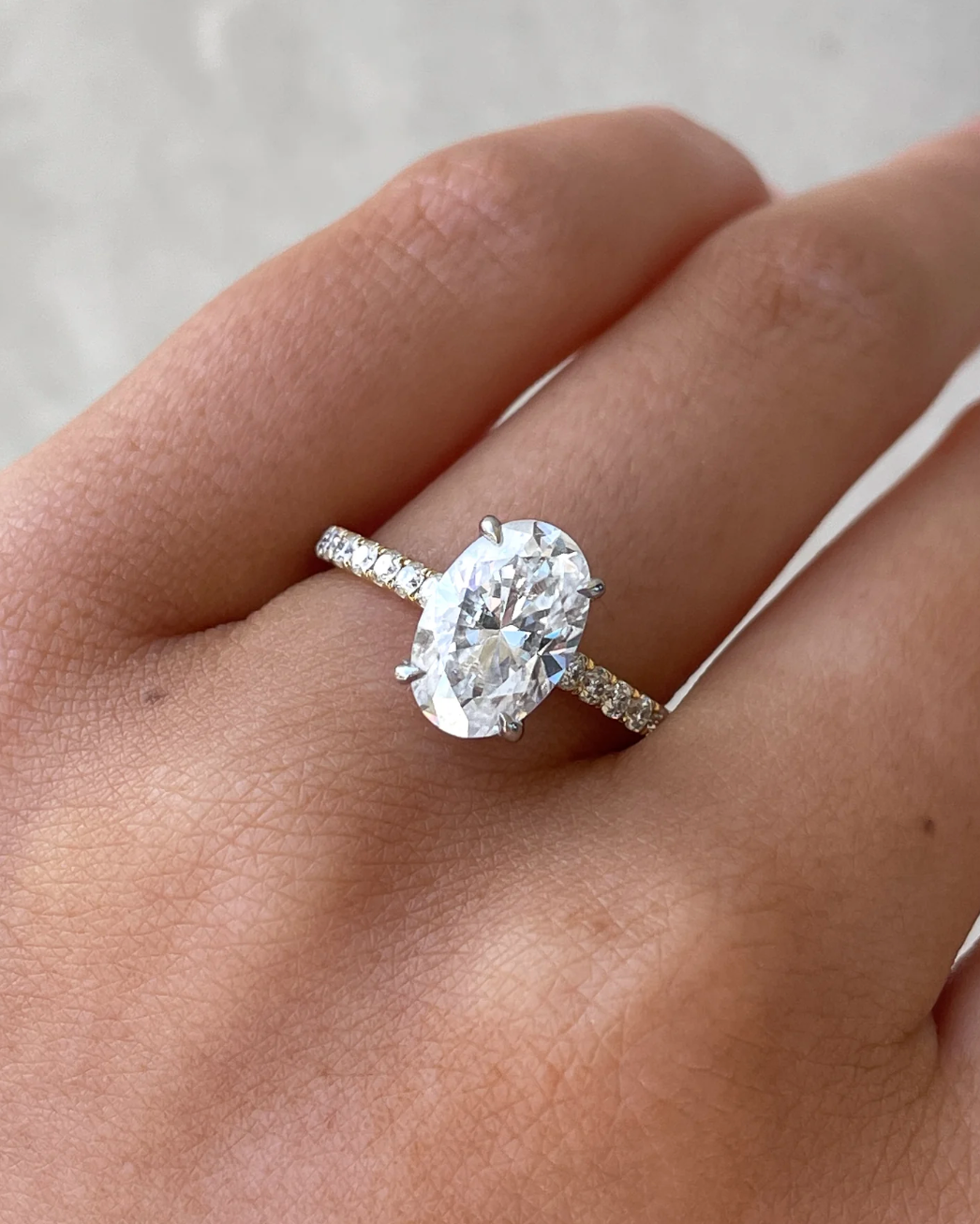 Oval Solitaire with Hidden Halo and Pavé